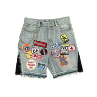 Harajuku style loose denim shorts with gothic pockets and cartoon design
