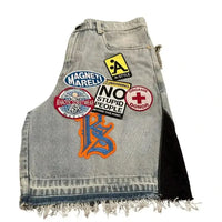 Harajuku style loose denim shorts with gothic pockets and cartoon design