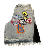 Harajuku style loose denim shorts with gothic pockets and cartoon design