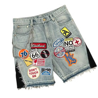 Harajuku style loose denim shorts with gothic pockets and cartoon design